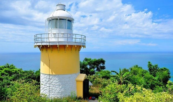 An ancient lighthouse towering in the middle of the sky